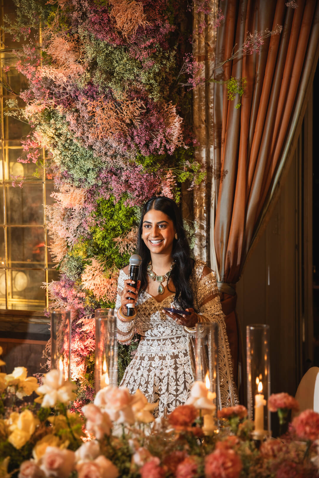bride delivering a wedding speech at an indoor reception in the Italian lakeside villa Erba