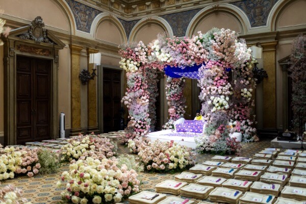 Traditional Indian wedding ceremony under a floral mandap on Lake Como, planned by Roberta Burcheri Events and pink floral mandap and aisle meadows for Luxury Indian wedding italy