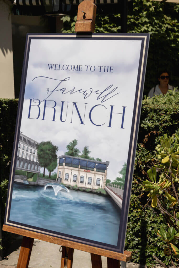 Farewell Brunch sign with painting of the venue in Italy