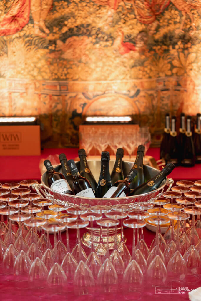 welcome cocktail in Florence Palazzo Gondi with wine chiller bowl, bottles of wine, and wine glasses