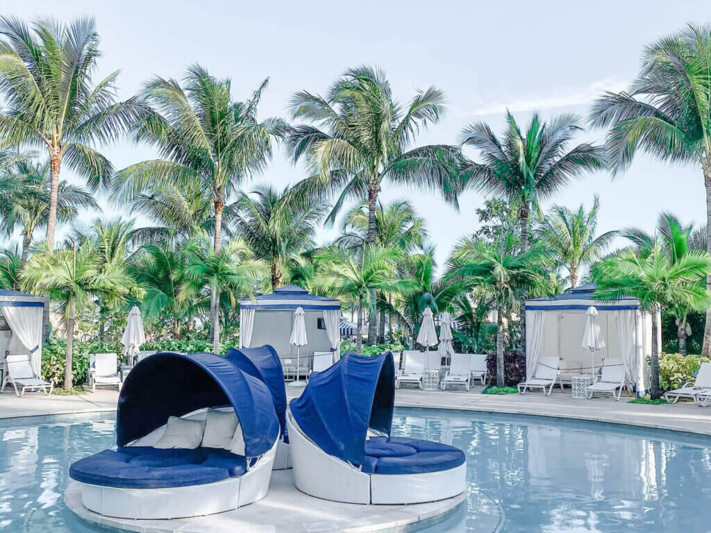 Luxury poolside cabanas prepared for chic bachelorette party planning